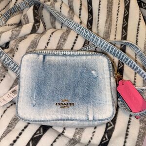 COACH Denim Camera Crossbody Bag in Light Blue Carey in loved denim with charms